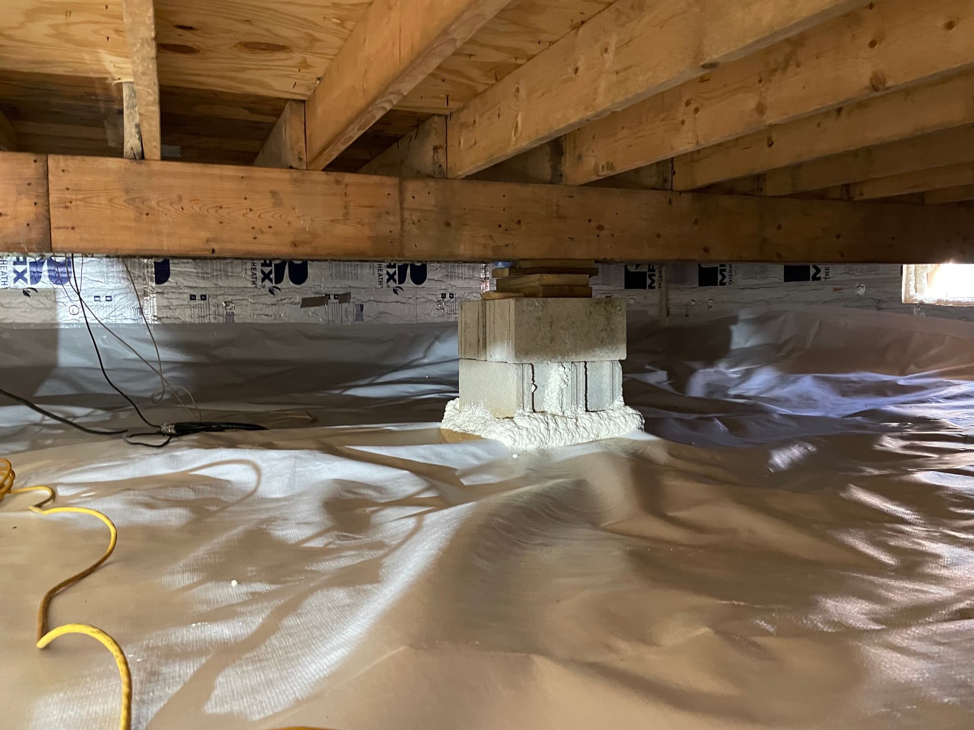 Unencapsulated crawlspace showing exposed dirt floor and foundation walls