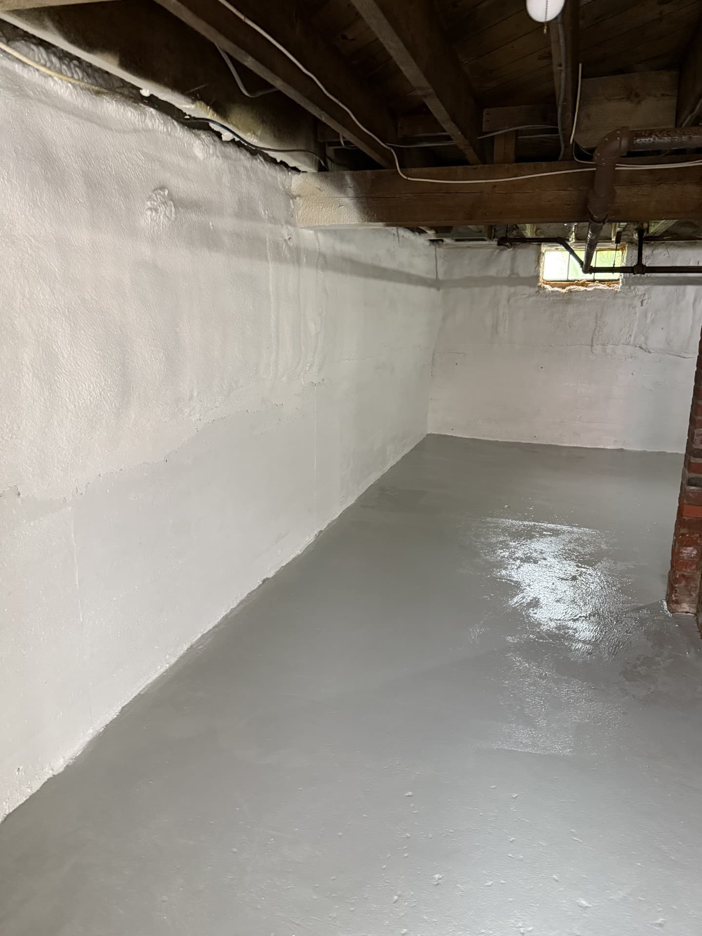 Spray foam insulation being applied in a Central Maine home by Nason's Home Solutions